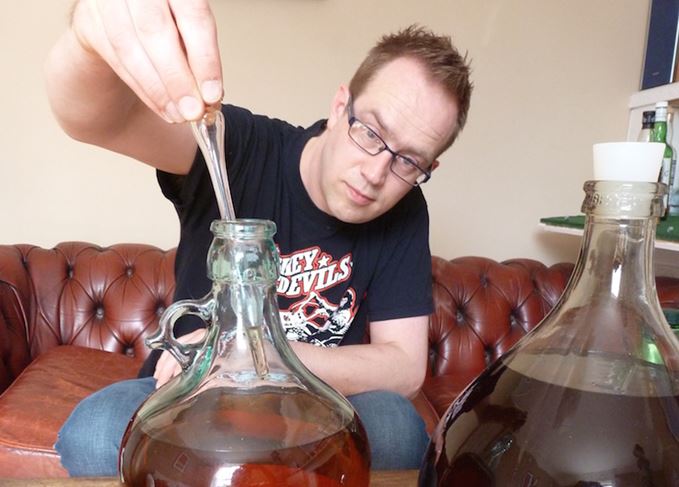 Easy does it: Tim Forbes adds to one of his home-made blends Tim Forbes blending whisky at home