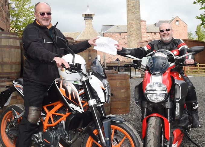 Easy riders: Neil Wilson and Malcolm Rennie clutching a map of Langholm. Neil Wilson and Malcolm Rennie
