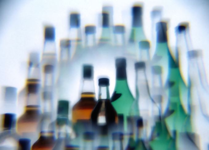 Just one more...? Over-indulgence has its consequences. Blurred bottles